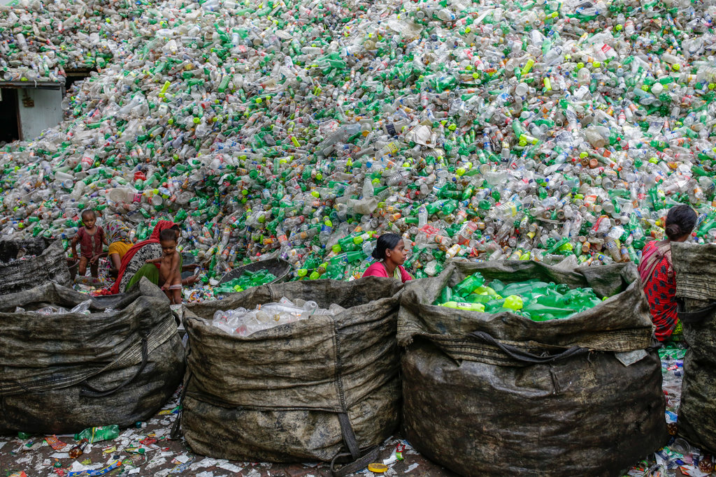 Female workers sort out plastic bottles for recycling in a factory in Dhaka, Bangladesh 26 October 2016. Plastic not only poses an immense pollution problemit also exacerbates climate change. If plastic production stays on its current trajectory, by 2030, greenhouse gas emissions from plastic could reach 1.34 billion tons per year, equivalent to the emissions produced by 300 new 500MW coal-fired power plants. © Abir Abdullah,Female workers sort out plastic bottles for recycling in a factory in Dhaka, Bangladesh 26 October 2016. Plastic not only poses an immense pollution problemâ??it also exacerbates climate change. If plastic production stays on its current trajectory, by 2030, greenhouse gas emissions from plastic could reach 1.34 billion tons per year, equivalent to the emissions produced by 300 new 500MW coal-fired power plants. Â© Abir Abdullah